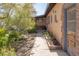 Pathway to entrance with mature trees and landscaping at 1200 Cashman Dr, Las Vegas, NV 89102