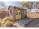 Detached shed with yellow doors and a wooden deck at 1200 Cashman Dr, Las Vegas, NV 89102