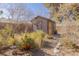 Detached shed with yellow doors and a wooden deck at 1200 Cashman Dr, Las Vegas, NV 89102