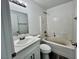 Bathroom features a tub, toilet, and vanity with a sink at 1881 Big Horn St, Pahrump, NV 89048