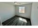 Bedroom with wood-look vinyl flooring and a window at 1881 Big Horn St, Pahrump, NV 89048