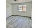Bedroom with wood-look vinyl flooring and a window at 1881 Big Horn St, Pahrump, NV 89048