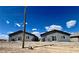 Exterior view of two modern single-story duplexes showcasing their simple design against a bright blue sky at 1881 Big Horn St, Pahrump, NV 89048