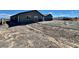 Exterior view of duplex units with a large yard and newly paved driveway at 1881 Big Horn St, Pahrump, NV 89048