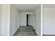 Hallway featuring modern floors and neutral paint connecting various rooms in the home at 1881 Big Horn St, Pahrump, NV 89048