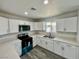 Modern kitchen featuring white cabinetry, countertops, and stainless-steel appliances at 1881 Big Horn St, Pahrump, NV 89048