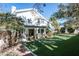 House backyard with covered patio and lawn at 2031 Mondo Ct, Las Vegas, NV 89123