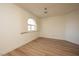 Simple bedroom with light walls and wood flooring at 2031 Mondo Ct, Las Vegas, NV 89123