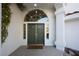 Home's entrance with double green doors at 2031 Mondo Ct, Las Vegas, NV 89123