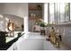 Close-up of a white apron front sink with a gooseneck faucet under a window in this kitchen at 2031 Mondo Ct, Las Vegas, NV 89123