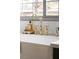 Close-up of the kitchen's stylish faucet and sink, complemented by white countertops and tiles at 2031 Mondo Ct, Las Vegas, NV 89123