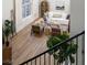 Open-concept living room with hardwood floors and stylish furnishings, as seen from above at 2031 Mondo Ct, Las Vegas, NV 89123