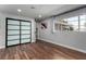 Bedroom with wood floors, sliding door and large window at 2617 Mason Ave, Las Vegas, NV 89102