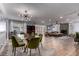 Open concept dining room with a large chandelier and stylish furniture at 2617 Mason Ave, Las Vegas, NV 89102