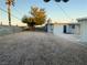 Large backyard with gravel and a tree at 2736 Taylor Ave, North Las Vegas, NV 89030