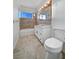 Clean bathroom with tub, vanity, and updated flooring at 2736 Taylor Ave, North Las Vegas, NV 89030