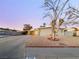 House exterior with a tree and driveway at 2736 Taylor Ave, North Las Vegas, NV 89030