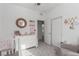 Bedroom with crib, dresser, and closet at 2883 Gunnery Forge St, Las Vegas, NV 89156