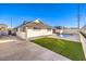 Artificial turf, concrete patio, and a kidney-shaped pool at 3517 Spencer St, Las Vegas, NV 89169