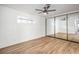 Bedroom with mirrored closet doors and ceiling fan at 3517 Spencer St, Las Vegas, NV 89169