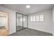 Bright bedroom with mirrored closet doors and grey carpet at 3517 Spencer St, Las Vegas, NV 89169