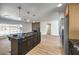 Contemporary kitchen boasting a large island and dark cabinetry at 3517 Spencer St, Las Vegas, NV 89169