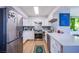 Modern white kitchen with geometric backsplash and stainless steel appliances at 3930 University Center Dr # 512, Las Vegas, NV 89119