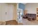 Living room with brown leather sectional and large mirror at 4137 Keasberry Ave, North Las Vegas, NV 89081