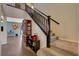 Staircase with dark wood railings and carpeted steps at 4137 Keasberry Ave, North Las Vegas, NV 89081