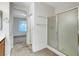 Bathroom with shower stall and view into bedroom at 5327 Progresso St, Las Vegas, NV 89135