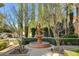 Ornate fountain in a landscaped courtyard with trees and stonework at 5327 Progresso St, Las Vegas, NV 89135