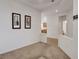 Bright living room with tile flooring and views into kitchen at 5327 Progresso St, Las Vegas, NV 89135