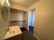 Bathroom with gray vanity, updated flooring and shelving at 5337 Hacienda Cir, Las Vegas, NV 89120