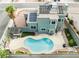 Aerial view of backyard with a refreshing private pool, pergola covered grill, and easy-care desert landscaping at 6112 Browning Way, Las Vegas, NV 89130