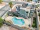Aerial view of a backyard with a refreshing pool, outdoor kitchen, solar panels, and desert landscaping at 6112 Browning Way, Las Vegas, NV 89130
