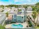 Aerial view of a home featuring a sparkling pool, outdoor kitchen, solar panels, and lush landscaping at 6112 Browning Way, Las Vegas, NV 89130