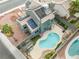 Aerial view of private backyard with a refreshing pool, outdoor kitchen, and solar panels above at 6112 Browning Way, Las Vegas, NV 89130