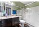 Bathroom with dark vanity, shower, and toilet at 6112 Browning Way, Las Vegas, NV 89130