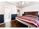 Spacious bedroom with wood floors and en-suite bathroom at 6112 Browning Way, Las Vegas, NV 89130