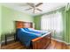 Bedroom with wood floors and ceiling fan at 6112 Browning Way, Las Vegas, NV 89130