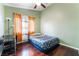 Bright bedroom with wood floors and window coverings at 6112 Browning Way, Las Vegas, NV 89130