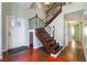 Elegant entryway with a hardwood staircase and unique flooring at 6112 Browning Way, Las Vegas, NV 89130