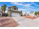 Charming home with a large garage and low-maintenance desert landscaping at 6112 Browning Way, Las Vegas, NV 89130
