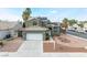 Two-story house with solar panels and a large driveway at 6112 Browning Way, Las Vegas, NV 89130