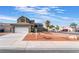 Two-story house with solar panels and a landscaped front yard at 6112 Browning Way, Las Vegas, NV 89130