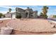 Two-story house with a landscaped front yard and driveway at 6112 Browning Way, Las Vegas, NV 89130