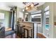 Home bar with rustic wood accents and pool view at 6112 Browning Way, Las Vegas, NV 89130