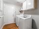 Laundry room with washer, dryer, and storage at 6112 Browning Way, Las Vegas, NV 89130