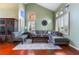 Spacious living room featuring a sectional sofa and high ceilings at 6112 Browning Way, Las Vegas, NV 89130