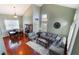 Spacious living room with high ceilings, a large sectional sofa, and a formal dining area at 6112 Browning Way, Las Vegas, NV 89130